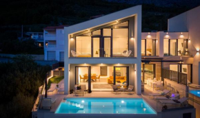 NEW! Three-bedroom Villa Sunshine with a heated pool, media room, and views of the sea